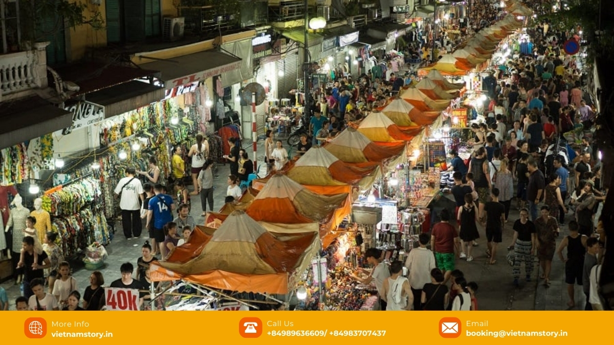 Vietnam Night Markets: A Vibrant Guide to Culture, Food & Shopping 9 Shoppers browse stalls under tents at the bustling Hanoi Old Quarter Night Market.