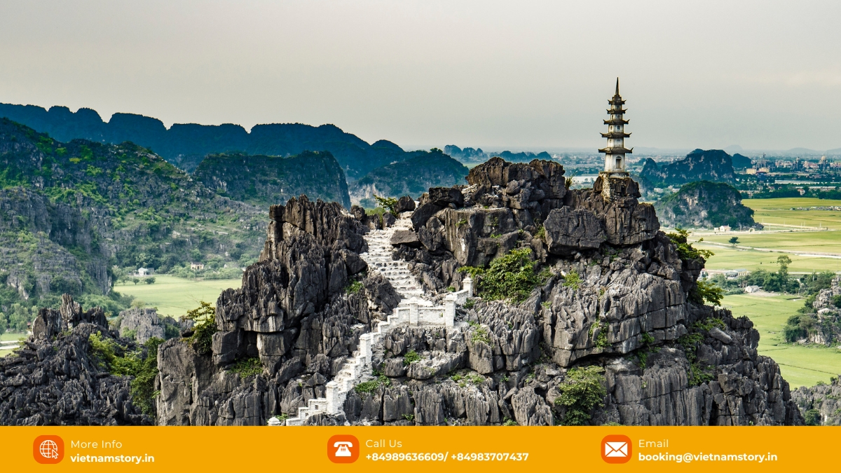 The panoramic Hang Mua viewpoint from the peak of Lying Dragon Mountain The panoramic Hang Mua viewpoint from the peak of Mua Caves Ninh Binh, showing limestone karsts and rice paddies.