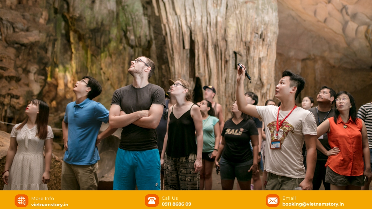 The Halong Loop: Immersive Guide For Indian Travelers 3 Tourists taking pictures with Halong Bay Surprise Cave